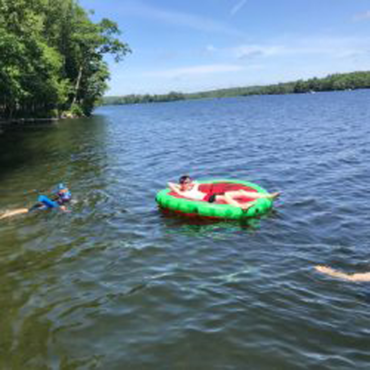 Kids swimming/floating in the water